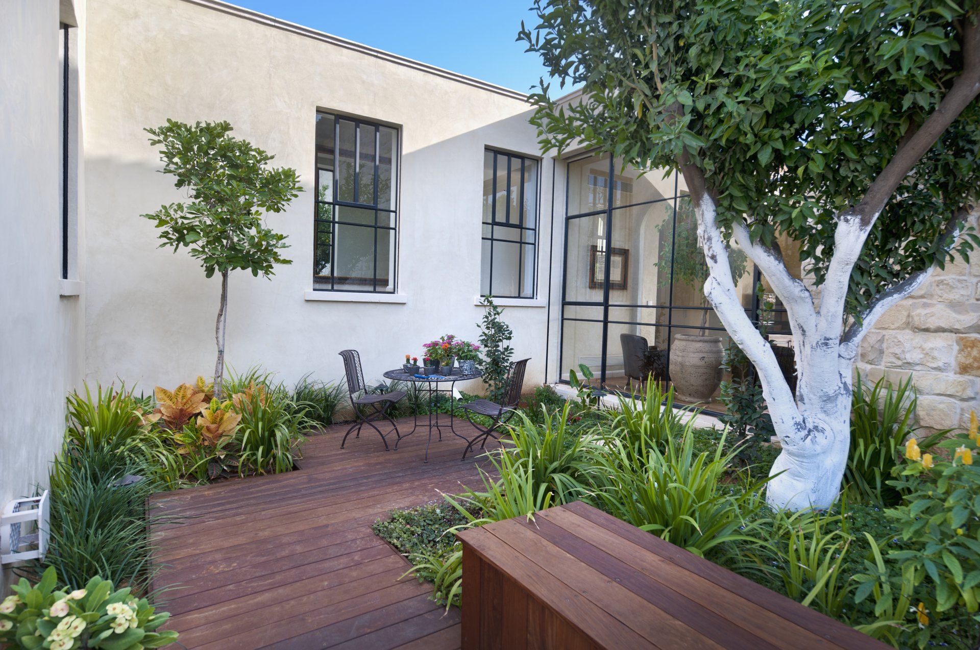 Courtyard garden with wood decking in Yorba Linda